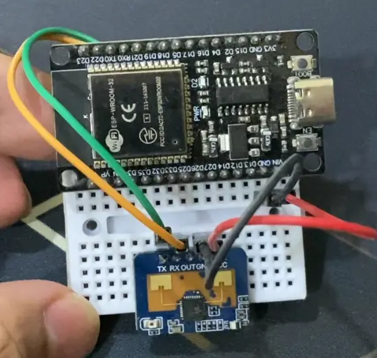 My DIY human presence sensor using ESP32 and LD2410C on a breadboard with a few jumper wires to connect each components