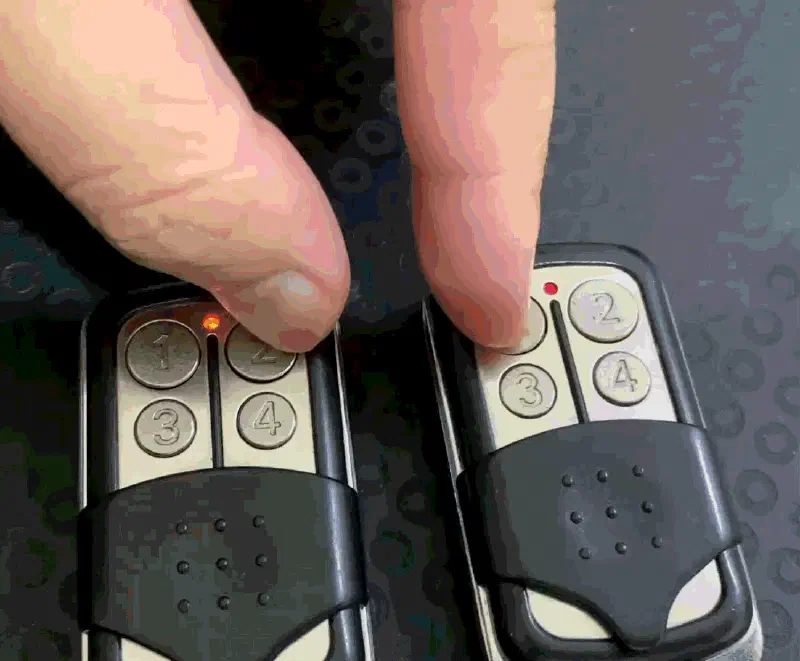 Two remote control in the picture. The right remote control is working, and the indicator light stays solid when I press the button. The left remote control is not working, and the indicator light blinks when I press the button.